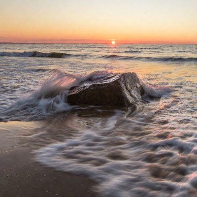 Ocean Waves Crashing on Rock at Sunset