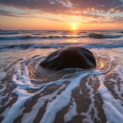 Sunset Over Waves Around Beach Rock