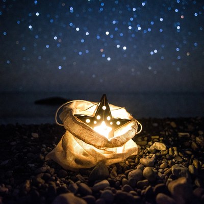 Glowing Star in Sack on Beach