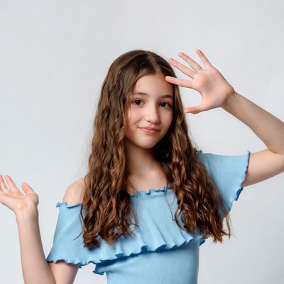 Girl making heart hands gesture