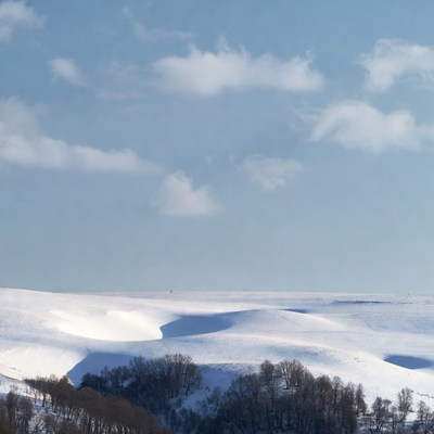 Snowy Hills Under Blue Sky
