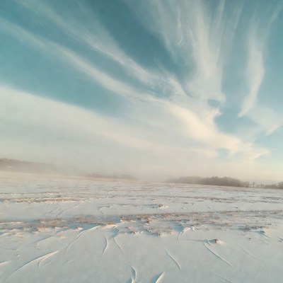 Snowy Field Under Blue Cloudy Sky