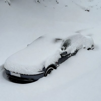 Car buried in heavy snow