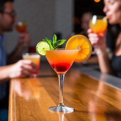 Cocktail with orange lime on bar