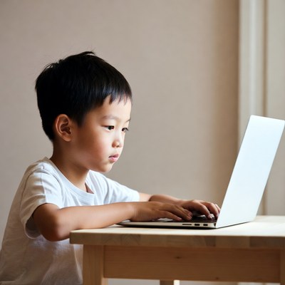 Asian boy using laptop