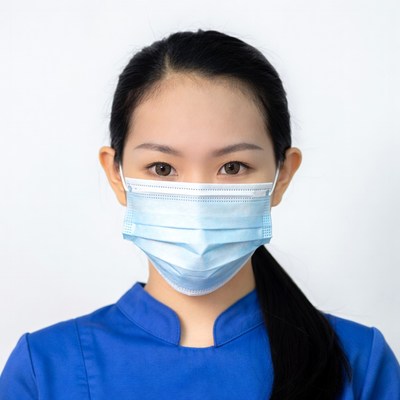 Asian woman wearing blue face mask