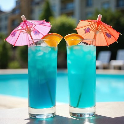 Blue Cocktails with Pink Umbrellas Poolside