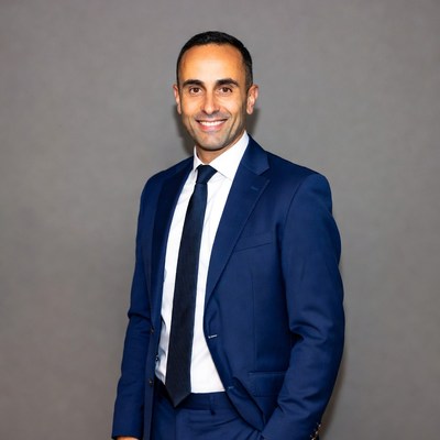 Smiling Middle Eastern man in blue suit