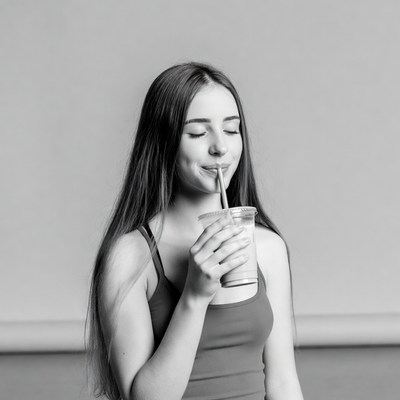 Girl drinking from straw cup