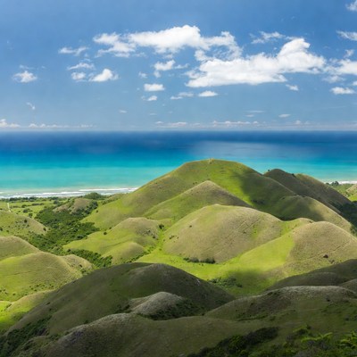Green Hills and Turquoise Ocean View