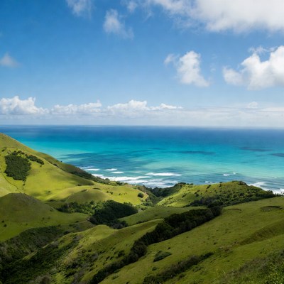 Green Hills Overlooking Turquoise Ocean