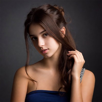 Young woman touching hair closeup