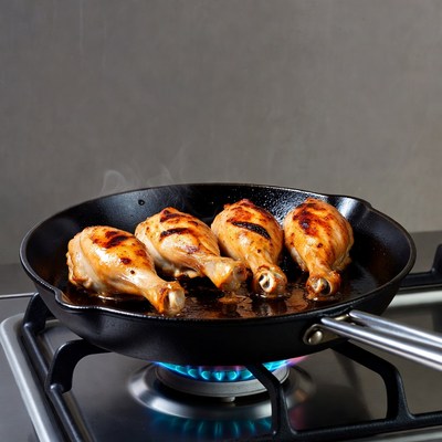Chicken Drumsticks Cooking in Skillet