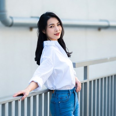 Asian woman leaning on railing