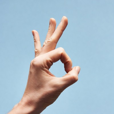 Hand making OK sign