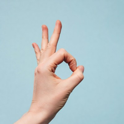 Hand making OK sign