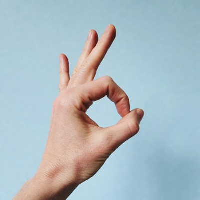 Hand making OK sign