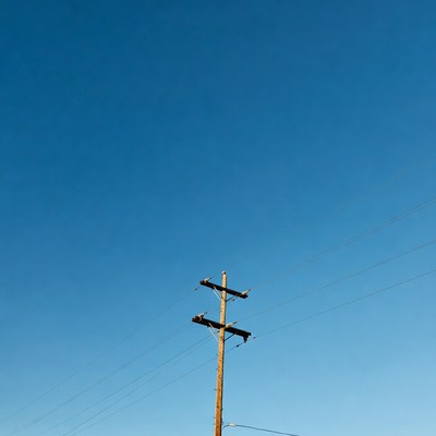 Utility Pole Against Blue Sky