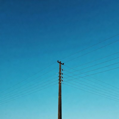 Utility Pole Against Blue Sky