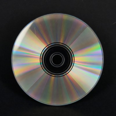 Shiny CD Disc on Black Background