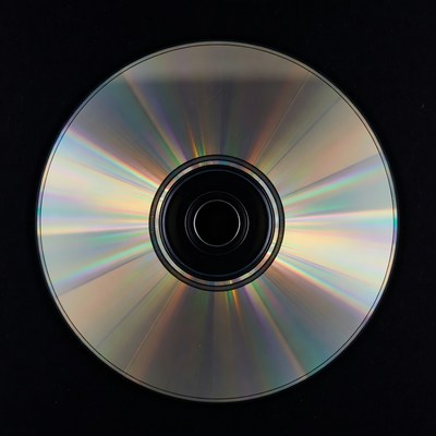 Shiny CD Disc on Black Background