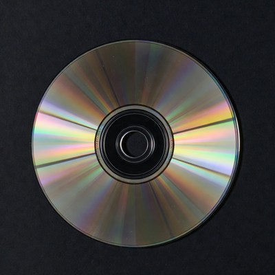 Shiny CD Disc on Black Background