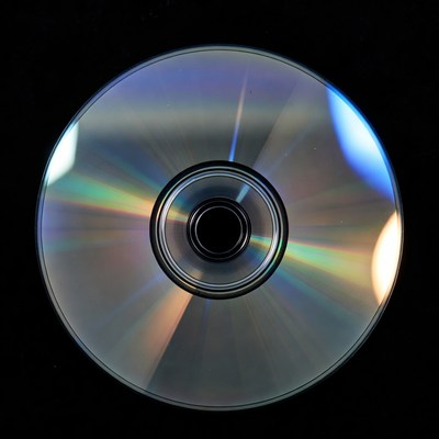 Shiny CD Disc on Black Background