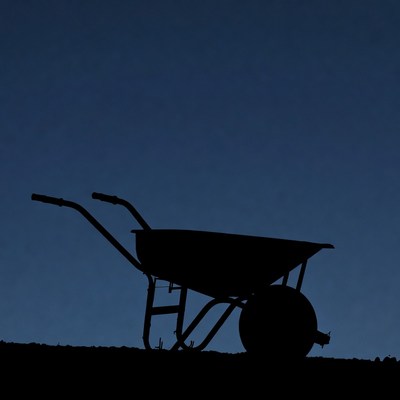 Wheelbarrow Silhouette on Dark Background