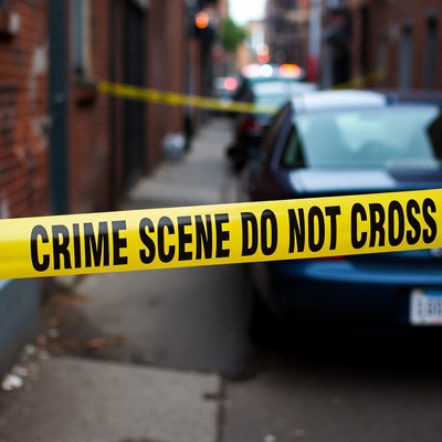 Crime Scene Tape in Brick Alley