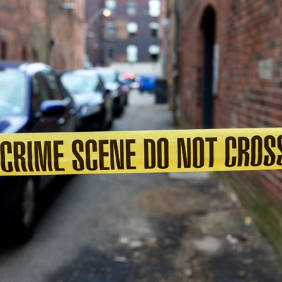 Crime Scene Tape in Urban Alley