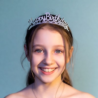 Girl wearing Happy Birthday tiara