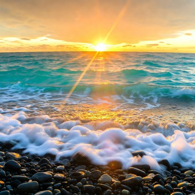 Sunset over turquoise ocean waves