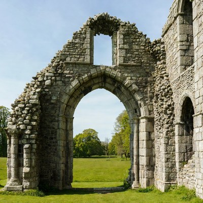 Ruined Stone Archway in Green Field