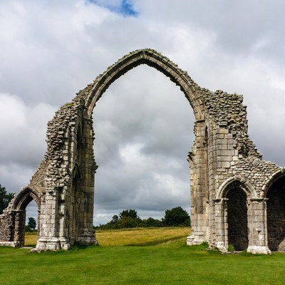 Medieval Stone Arch Ruins in Grass