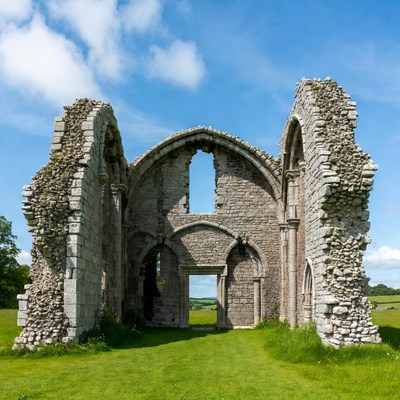 Ruined Stone Archway in Green Field