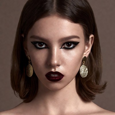 Woman with bold eyeliner and red lips
