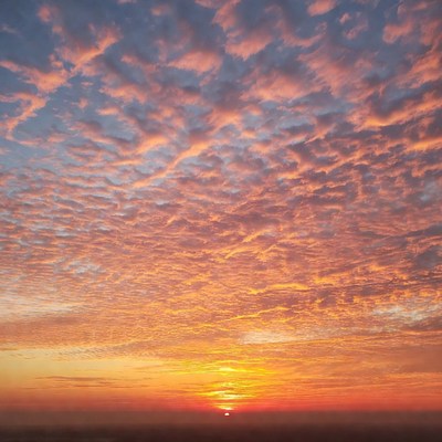 Vibrant Sunset with Orange Clouds