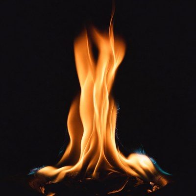 Bright orange flame on black background