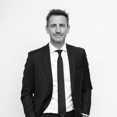 Man in black suit white shirt