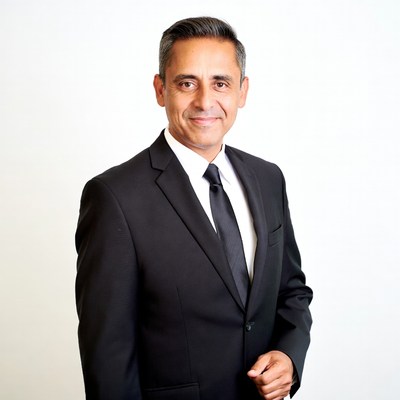Smiling man in black suit