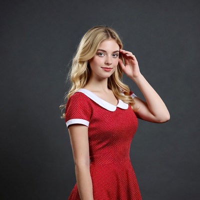 Blonde woman in red polka dot dress