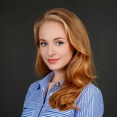Woman with long red hair in striped shirt