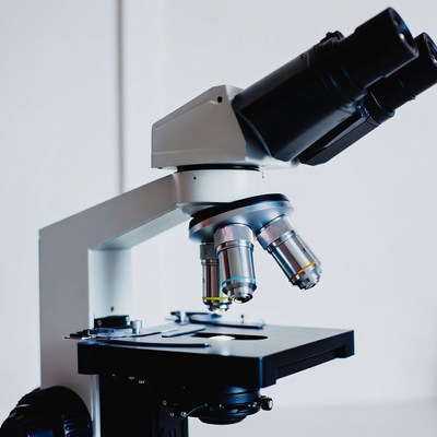Compound microscope on white background