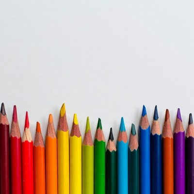 Colorful pencils arranged in rainbow