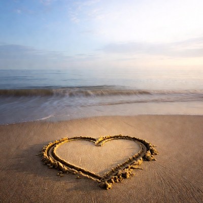 Heart drawn in beach sand