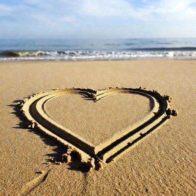 Heart drawn in beach sand