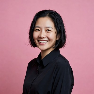 Smiling Asian woman in black shirt