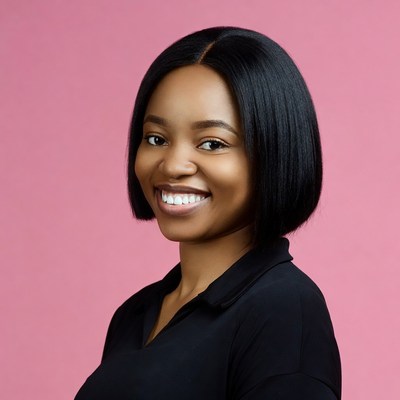 Smiling African-American woman on pink background