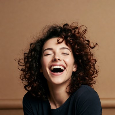 Woman laughing with curly hair