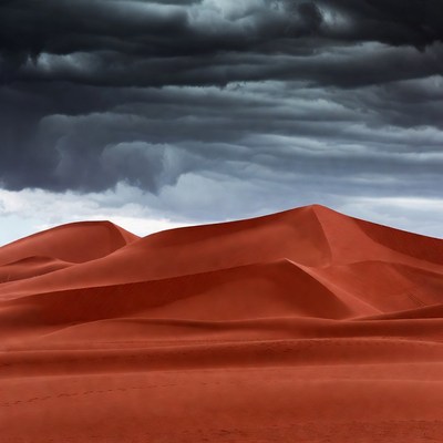 Dark Storm Clouds over Red Sand Dunes